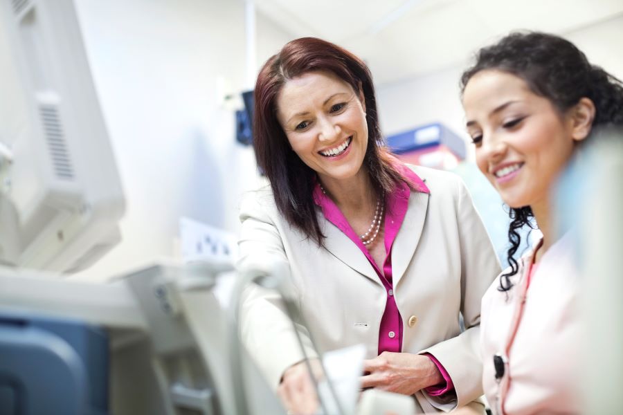 Two healthcare workers talking