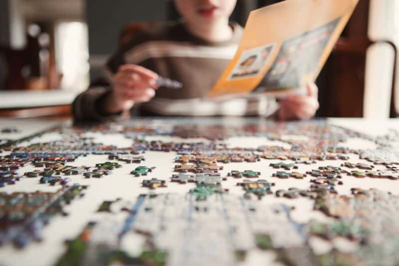 Woman Doing A Puzzle
