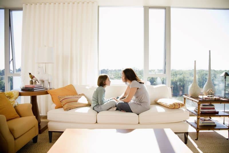 Mother and Daughter Sitting on Couch